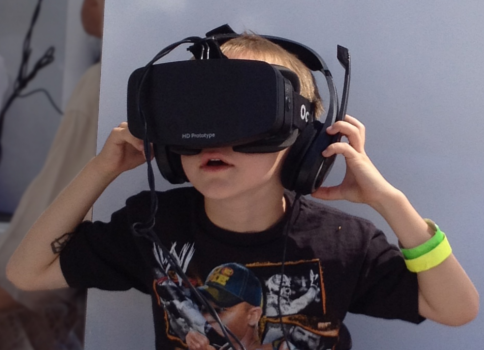 Young boy using an Oculus Rift HD Prototype headset and headphones. Image credit: Skydeas, Wikipedia Commons